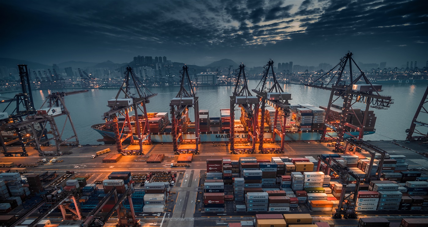 Aerial view of a container ship travelling across deep blue water
